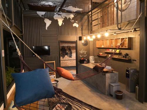 a room with two hammocks hanging from the ceiling at Asleep by Lantana in North Pattaya