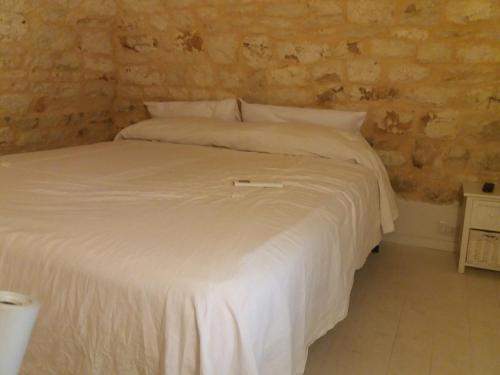 מיטה או מיטות בחדר ב-Il Castello