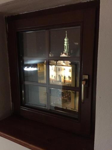 a view of a building from a window at Apartmány v pivovaru in Kašperské Hory