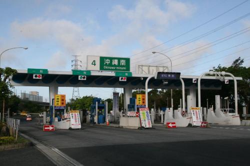 a gas station with a sign on the side of it at Crown Hotel Okinawa in Okinawa City