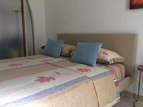 a bed with two pillows on top of it at casa gramazio in Manfredonia
