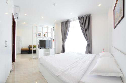 Giường trong phòng chung tại Grace Apartment 3