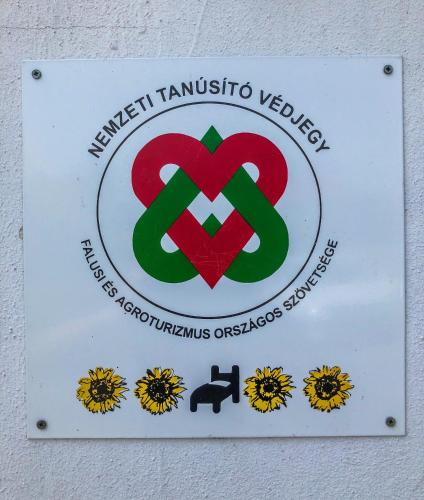 a sign for a veterinary clinic with two hearts at Tulipános vendégház in Fertőszentmiklós