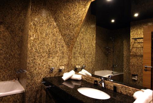a bathroom with a sink and a mirror at Art Complex Anel in Sozopol