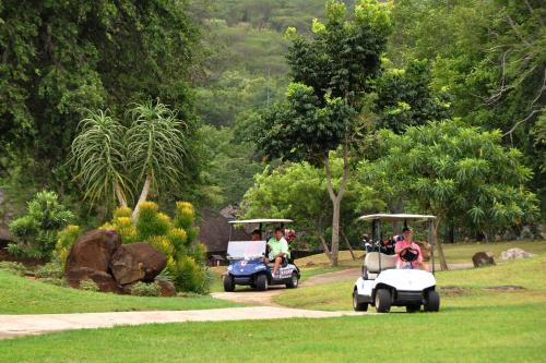 a group of people riding golf carts in a park at Kruger Park Lodge Unit No. 612 in Hazyview