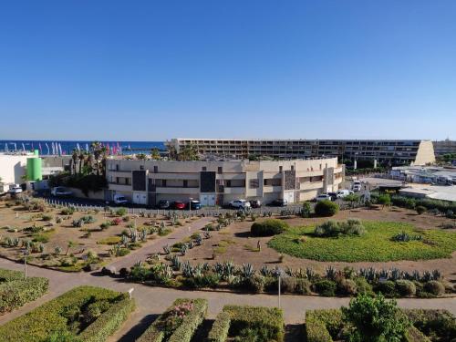 an aerial view of a building with a park at Clubber Naturiste Design in Cap d'Agde