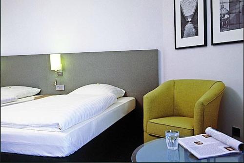 Ένα ή περισσότερα κρεβάτια σε δωμάτιο στο Overnight Tagungshotel im ABZ