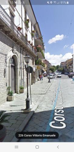 a street with a sign on the side of a building at Suites storica in Palazzo antico del 1858 in pieno centro in Agnone