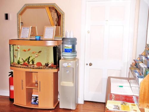 a fish tank and a water bottle in a room at The Willows - Room Only Accommodation in Fort William