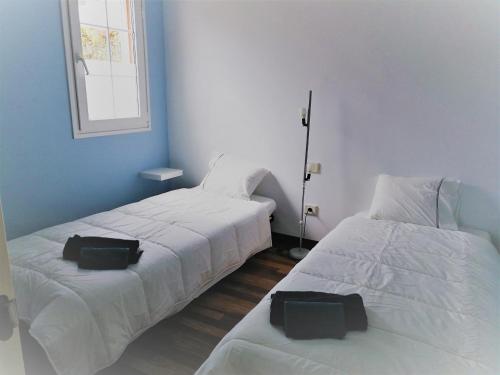 Postel nebo postele na pokoji v ubytování APARTAMENTO LEMMON TREE