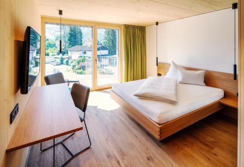 Postel nebo postele na pokoji v ubytování Hotel Krone