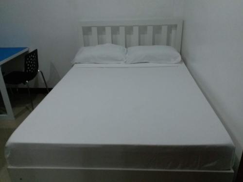 Postel nebo postele na pokoji v ubytování Clark-Pad Inn, Angeles City
