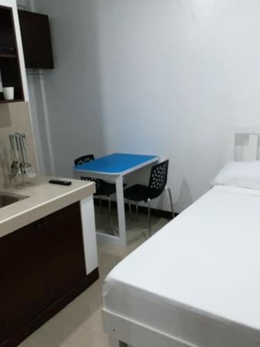 Postel nebo postele na pokoji v ubytování Clark-Pad Inn, Angeles City