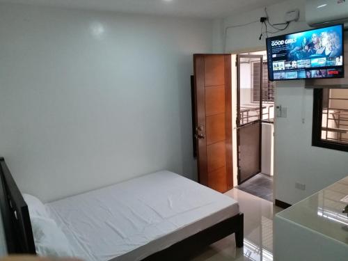 Postel nebo postele na pokoji v ubytování Clark-Pad Inn, Angeles City