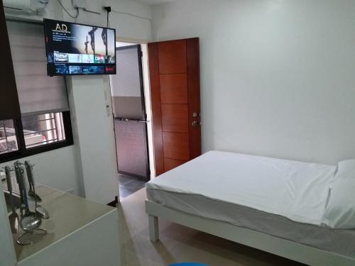 Postel nebo postele na pokoji v ubytování Clark-Pad Inn, Angeles City