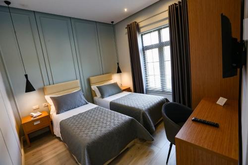 Postel nebo postele na pokoji v ubytování Home Hotel