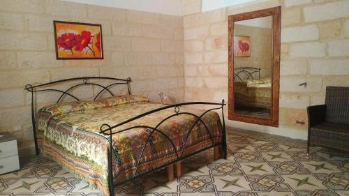 Postel nebo postele na pokoji v ubytování La terrazza sul castello