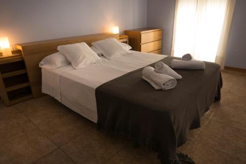 Un ou plusieurs lits dans un hébergement de l'établissement Casa Candio