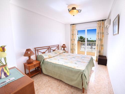 En eller flere senger på et rom på Puerto y Playa Apartments La Manga