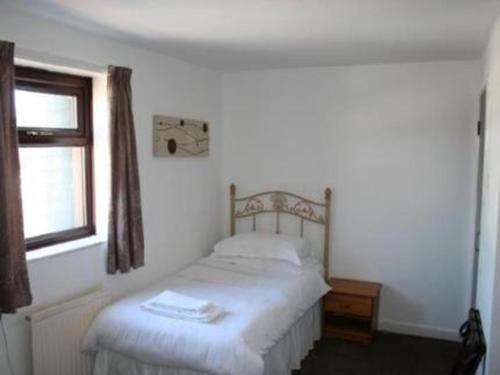 Katil atau katil-katil dalam bilik di Beverley Inn & Hotel