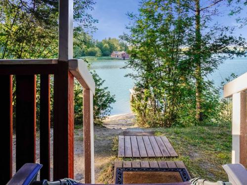 a porch with a view of a lake at Holiday Home Rantasipi 1 by Interhome in Strandby
