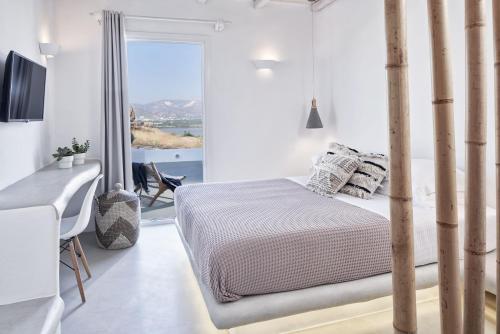 Postel nebo postele na pokoji v ubytování Naxian Utopia | Luxury Villas & Suites