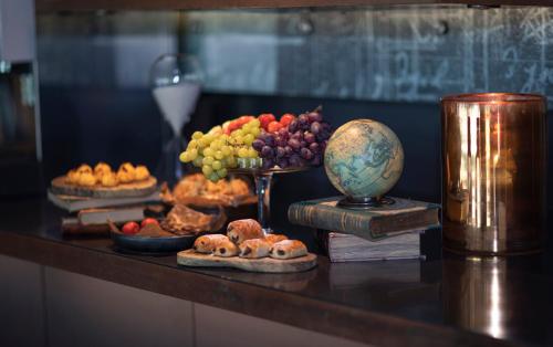 a table topped with different types of fruits and pastries at Radisson Blu Riverside Hotel in Gothenburg