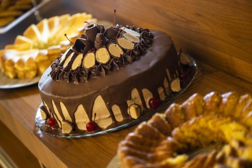 a chocolate cake sitting on top of a table at Del Mar Hotel in Aracaju