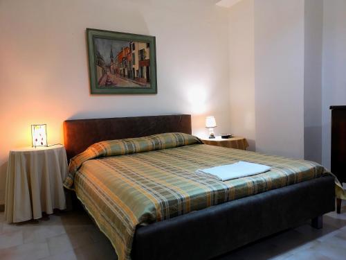 a bedroom with a bed with a laptop on it at Leonidas Private Apartment in Sparta in Sparta