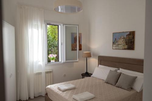 Postel nebo postele na pokoji v ubytování Mondello Felix - appartamenti in villa a 600m dal mare