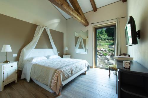 Un pat sau paturi într-o cameră la Ca Montiglio