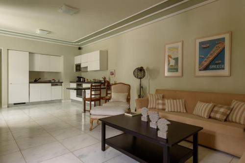 a living room with a couch and a table at Hydras Chromata in Hydra