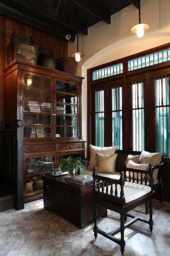 a living room with a couch and a coffee table at 1905 Heritage Corner in Bangkok