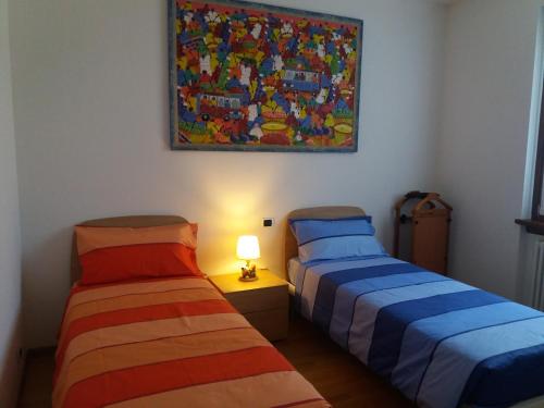 Llit o llits en una habitació de Casa Intignano - appartamento con terrazzo vista lago