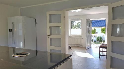 a kitchen with a counter and a refrigerator at Ferienhaus Meeresrauschen in Binz