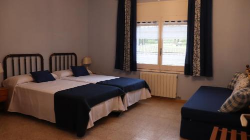 Postel nebo postele na pokoji v ubytování Lo Mas