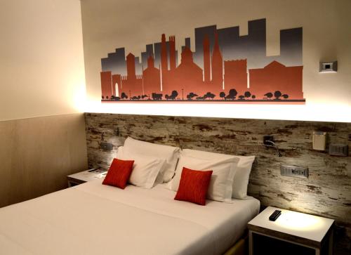 a hotel room with two beds with red pillows at Best Western Plus Soave Hotel in San Bonifacio
