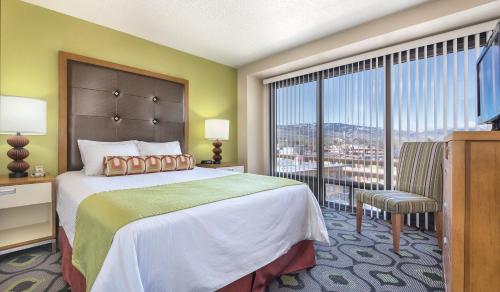 a hotel room with a bed and a large window at WorldMark Reno in Reno