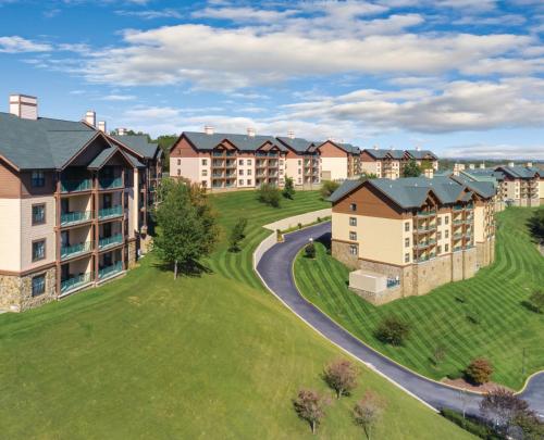 an aerial view of a apartment complex with a winding road at Club Wyndham Smoky Mountains in Pigeon Forge