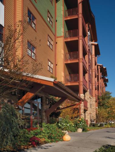 a building with a balcony on the side of it at Club Wyndham Great Smokies Lodge in Sevierville