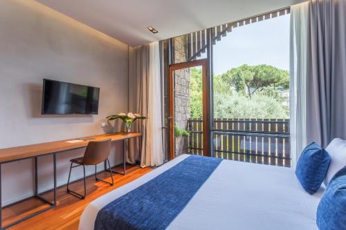 Postel nebo postele na pokoji v ubytování Fauno Urban Resort