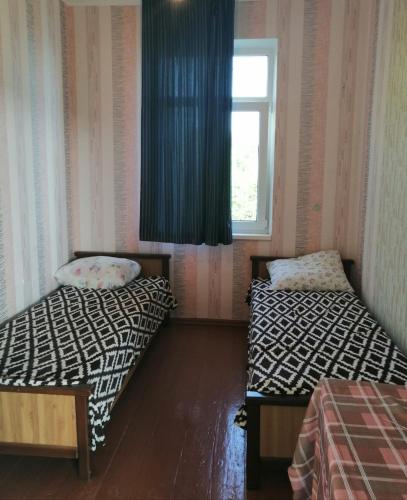 Postel nebo postele na pokoji v ubytování гостевой дом мимоза