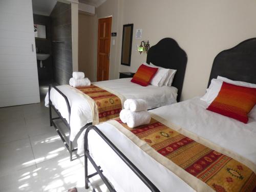Ένα ή περισσότερα κρεβάτια σε δωμάτιο στο Tsumeb Backpackers & Safari