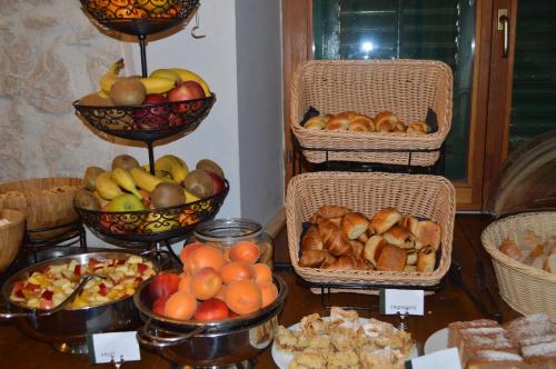 a table with baskets of different types of food at Hotel Villa Diana in Split