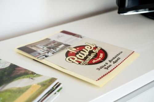 a book sitting on top of a table at Bütgenbach Ferienhaus Lorea in Butgenbach