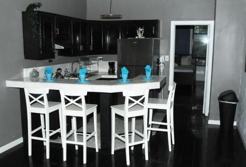 a kitchen with a counter and stools in a kitchen at Plush Spacious 1 bedroom apt Williamsburg in Brooklyn