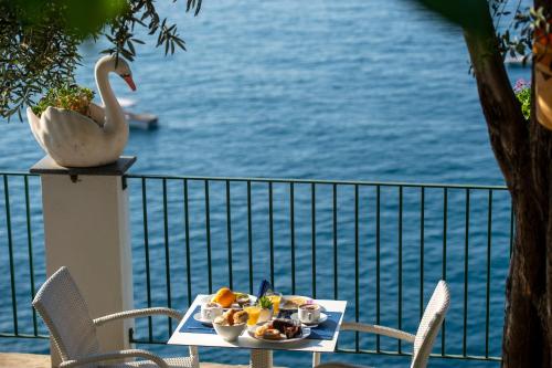 a tray of food on a table with a swan at Hotel Villa Maria Pia in Praiano