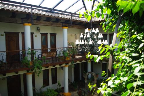 a building with balconies and a chandelier at Hotel Grand Maria in San Cristóbal de Las Casas