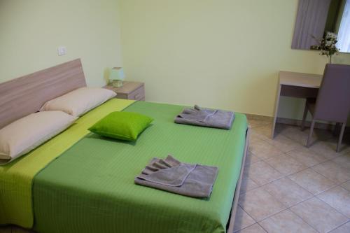Posteľ alebo postele v izbe v ubytovaní B&B La Vecchia Osteria