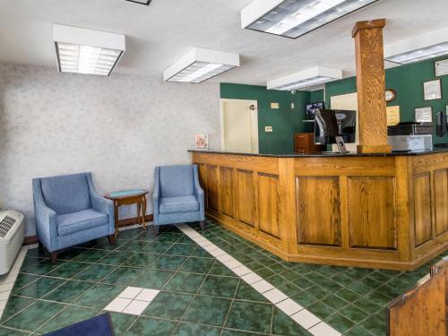 a waiting room with two chairs and a counter at Americas Best Value Inn - Clayton in Clayton